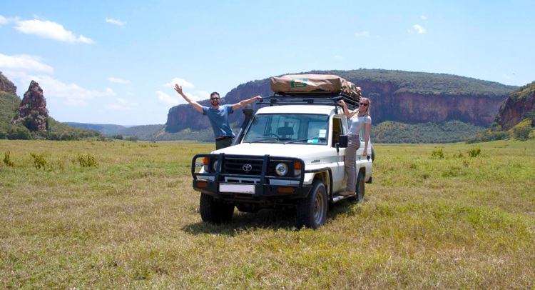Two roadtrippers in Hell's Gate Kenya, during their self-drive itinerary